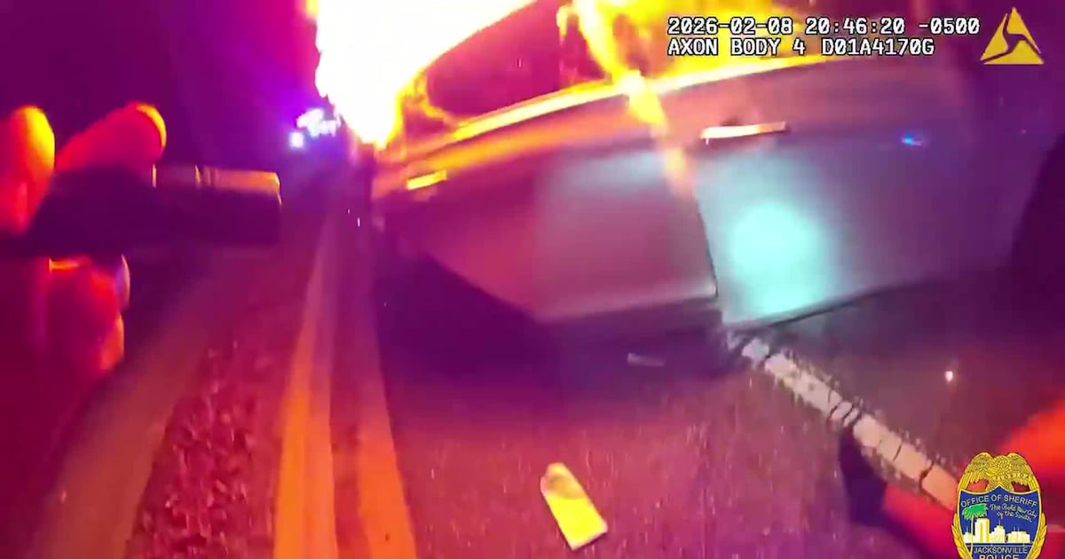 Jacksonville officer pulls woman from burning car during carjacking, man arrested – Action News Jax
