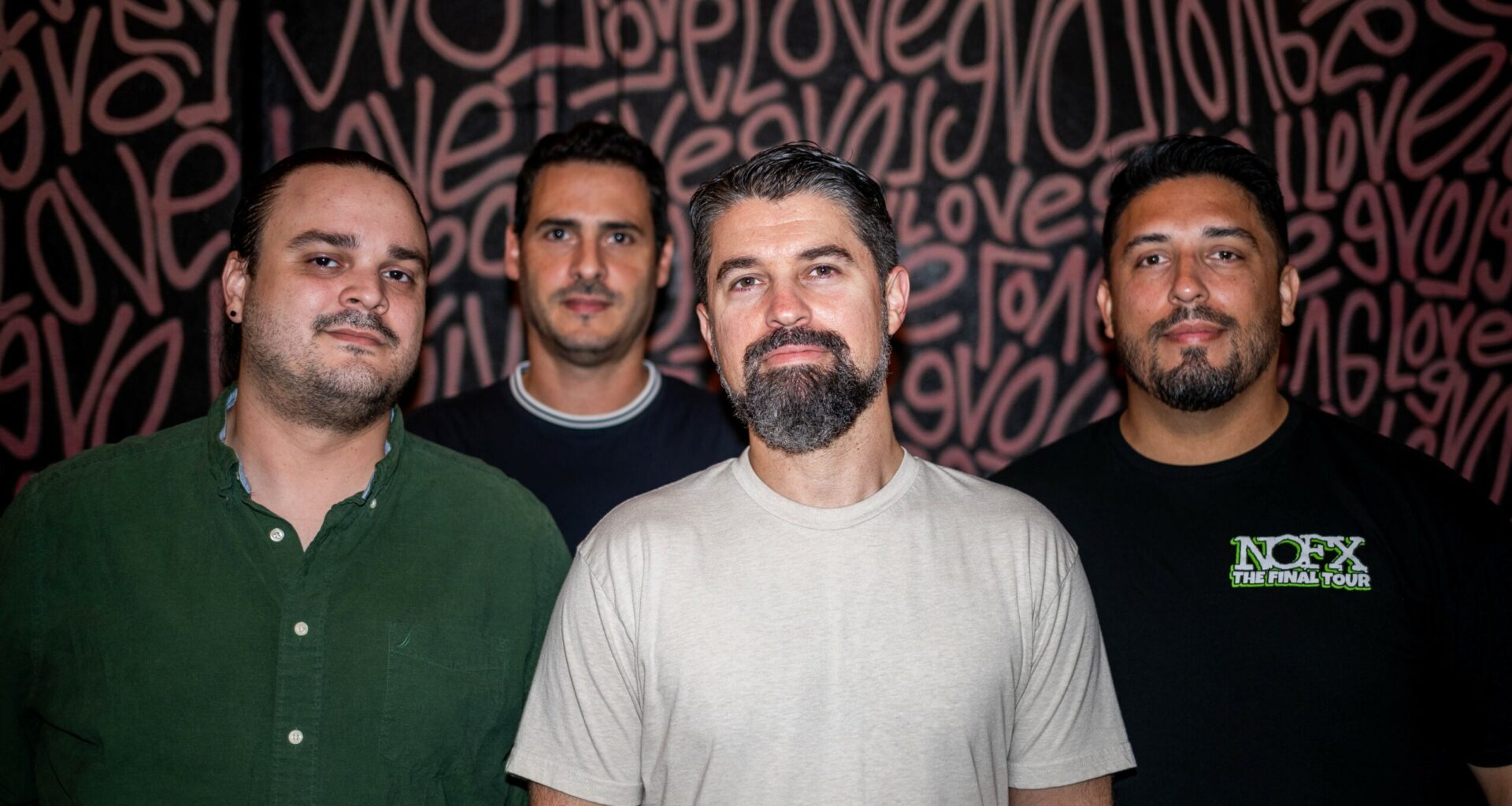 Photo of a band posing for the camera