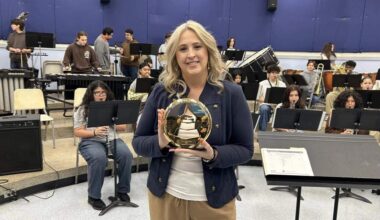 South Miami Senior High School’s Jennifer Jimenez holds her Grammy in her classroom. ‘It’s really tough to fund music education,’ she said.