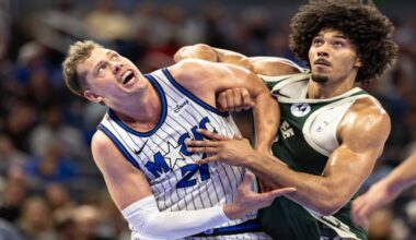 Orlando Magic forward/center Moritz Wagner, left, and Milwaukee Bucks center Jericho Sims fight for position on a rebound during the first half of an NBA basketball game, Wednesday, Feb. 11, 2026, in Orlando, Fla. (AP Photo/Willie J. Allen Jr.)