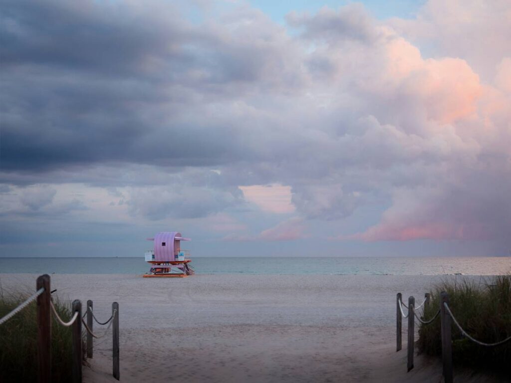 Pastel skies over a quiet Miami beach lifeguard tower, just before sunset