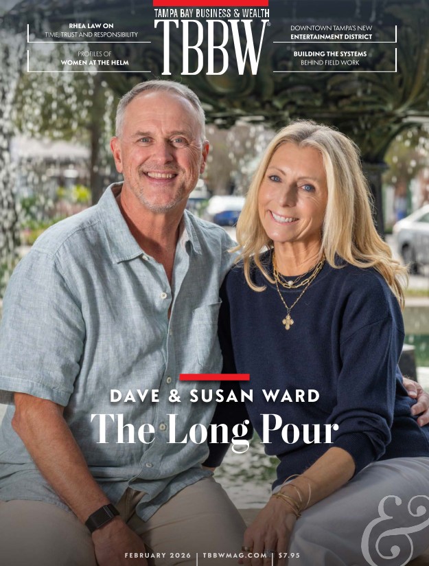 Dave and Susan Ward, co-founders of Buddy Brew Coffee, seated together outdoors in Tampa, photographed for the February 2026 cover of Tampa Bay Business & Wealth.