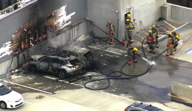 Vehicle fires in apartment parking garage fill hallways with smoke, fire officials say