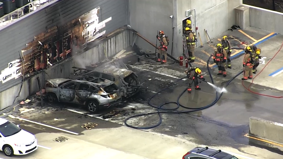 Vehicle fires in apartment parking garage fill hallways with smoke, fire officials say