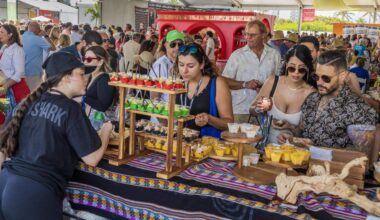 Sonny Mora serves different bites to guests at the Aromas del Peru restaurant booth at the Grand Tasting Village at the 2025 South Beach Wine & Food Festival. Tickets remain to this year’s Grand Tastings.