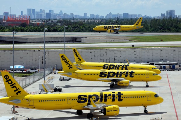 A Spirit Airlines airplane takes off as others are parked at Fort Lauderdale-Hollywood International Airport on Tuesday, Sept. 16, 2025. (Amy Beth Bennett / South Florida Sun Sentinel)