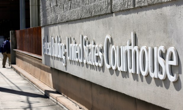 A man walks up the steps of the federal courthouse in Fort Lauderdale on Tuesday. (Amy Beth Bennett/South Florida Sun Sentinel)
