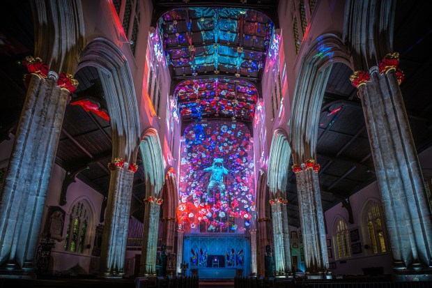 "Ascendance," a projection-mapped piece from Studio McGuire showing an astronaut adrift in the cosmos, is on display at ArtsPark at Young Circle in Hollywood for IGNITE Broward 2026. (Andre Pattenden for IGNITE Broward / Courtesy)