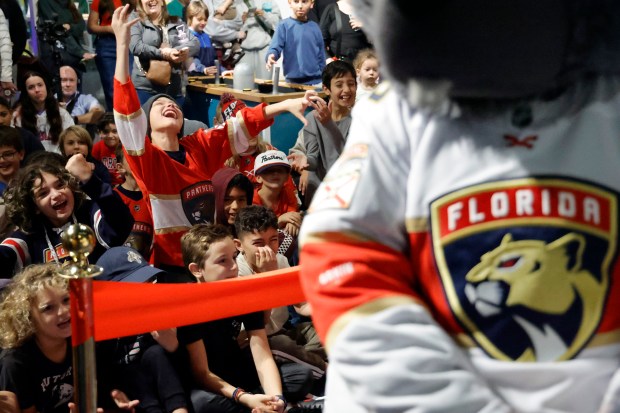 Kids react to Florida Panthers' mascot Viktor E. Ratt before the opening of the new "HOCKEY: Faster Than Ever" exhibit at the Museum of Discovery & Science in Fort Lauderdale on Friday, Jan. 30, 2026. (Amy Beth Bennett / South Florida Sun Sentinel)