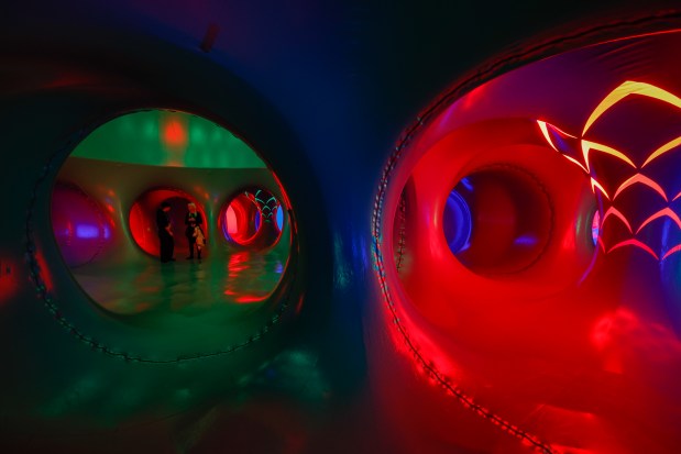 The Architects of Air Arborialis walk-through experience at the Seneff Arts Plaza at the Dr. Phillips Center for the Performing Arts on Friday, 2026. The large, cavernous 17,000-square-foot inflatable structure of fabric and air creates a colorful labyrinth connected by domes and vibrant walkways. It is filled with ephemeral music for an otherworldly experience that guests can explore as part of Immerse 2026. (Rich Pope/Orlando Sentinel)