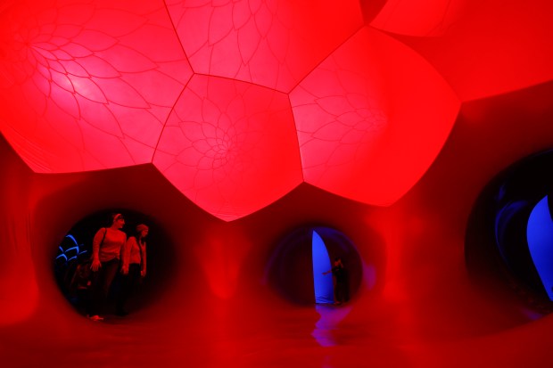 Sabrina and Allison Guimaraes explore the Architects of Air Arborialis walk-through experience at the Seneff Arts Plaza at the Dr. Phillips Center for the Performing Arts on Friday, 2026. The large, cavernous 17,000-square-foot inflatable structure of fabric and air creates a colorful labyrinth connected by domes and vibrant walkways. It is filled with ephemeral music for an otherworldly experience that guests can explore as part of Immerse 2026. (Rich Pope/Orlando Sentinel)