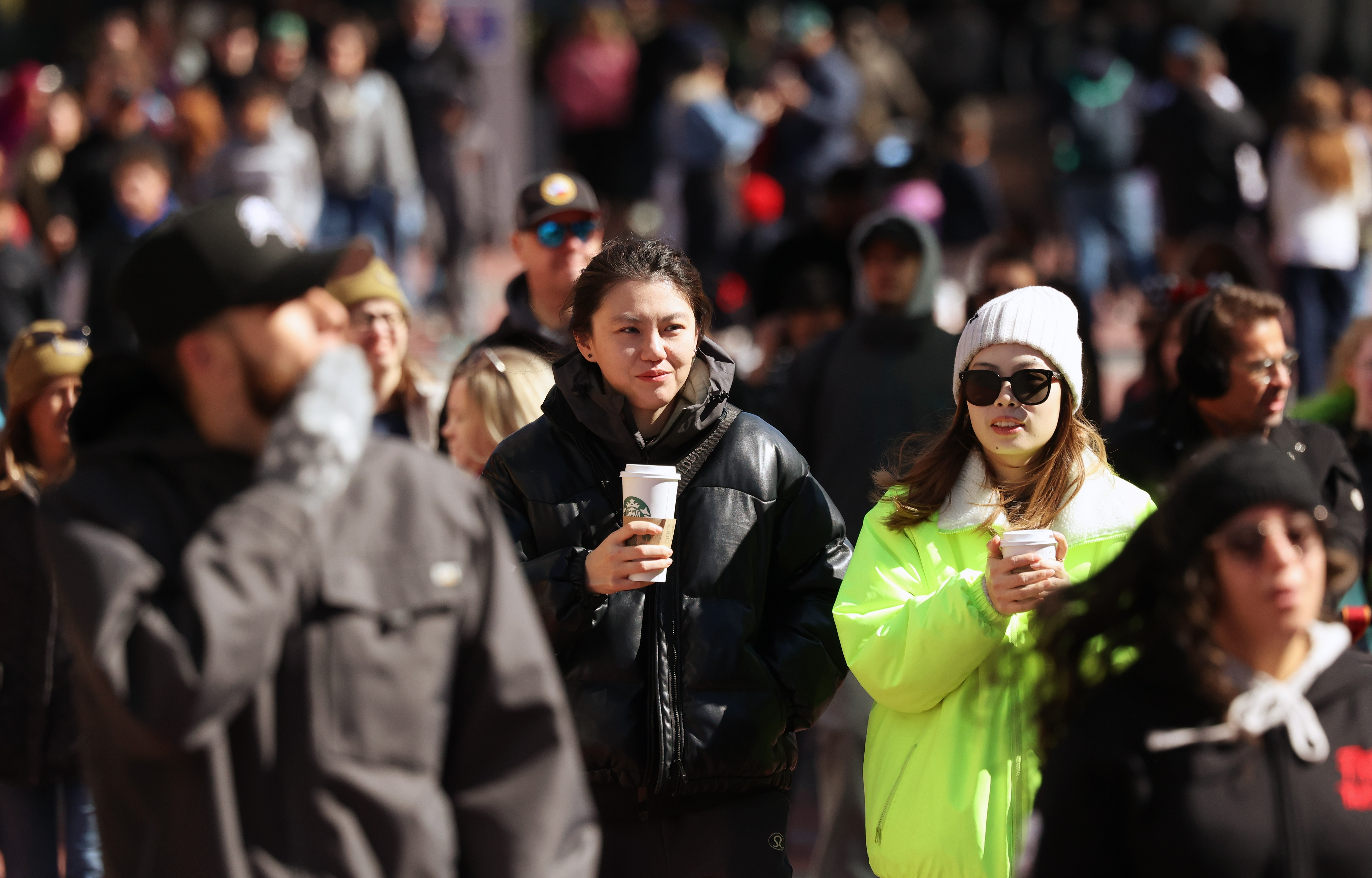 Parkgoers are bundled up at Universal CityWalk Orlando on Monday,...