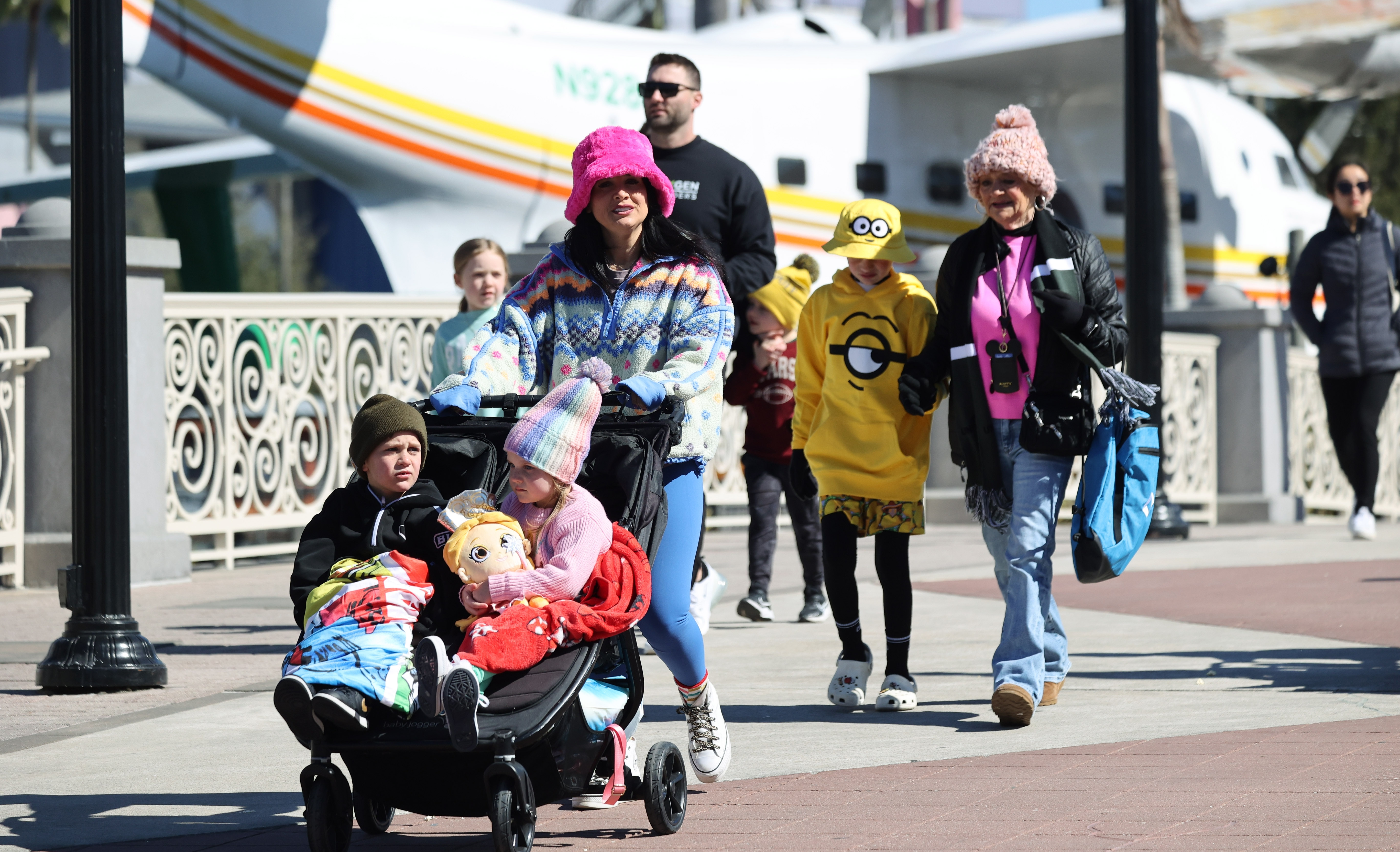Parkgoers are bundled up at Universal CityWalk Orlando on Monday,...