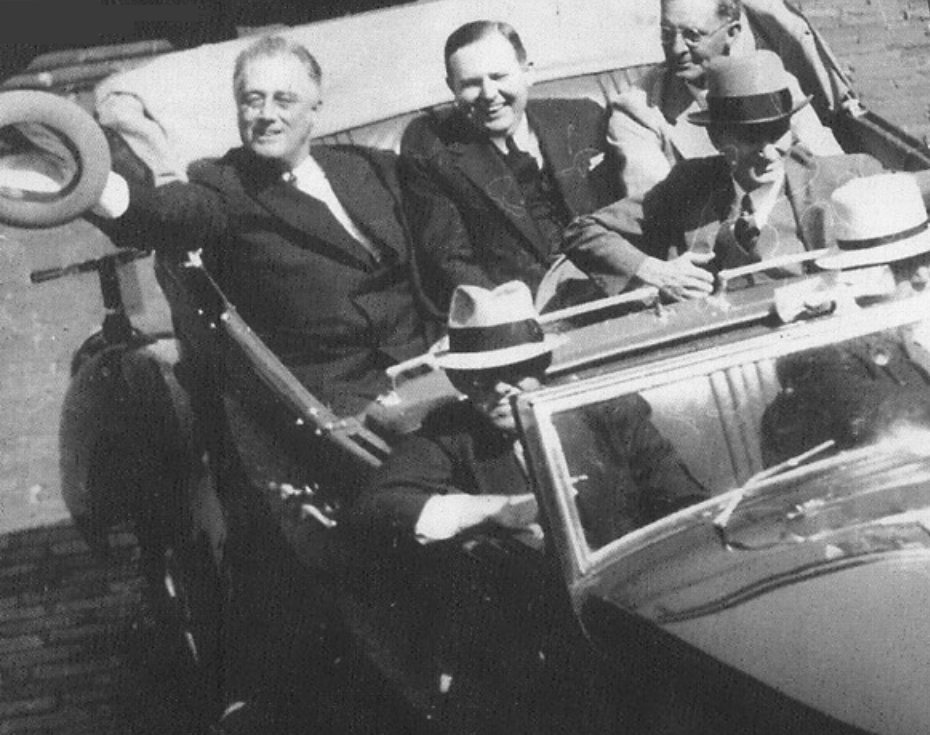 Photograph of President Franklin Delano Roosevelt riding in a car...