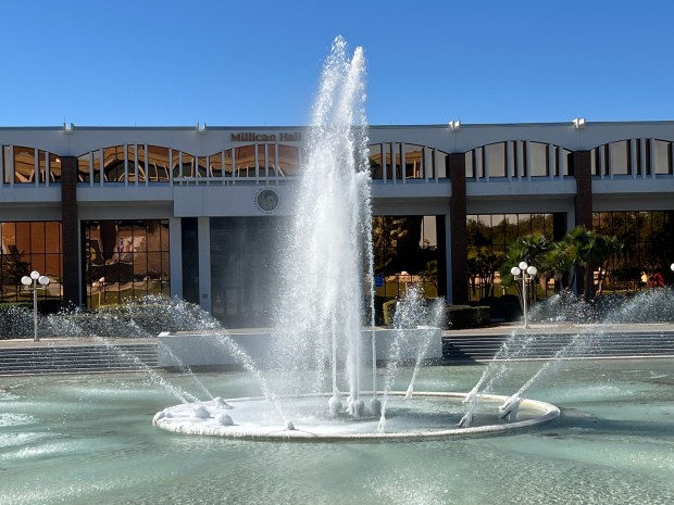 UCF stands for "U Can Freeze" as the university's icon reflecting pond in front of its administration and library building froze overnight because of the record cold temperature in Orlando. (Roger Simmons/Orlando Sentinel)