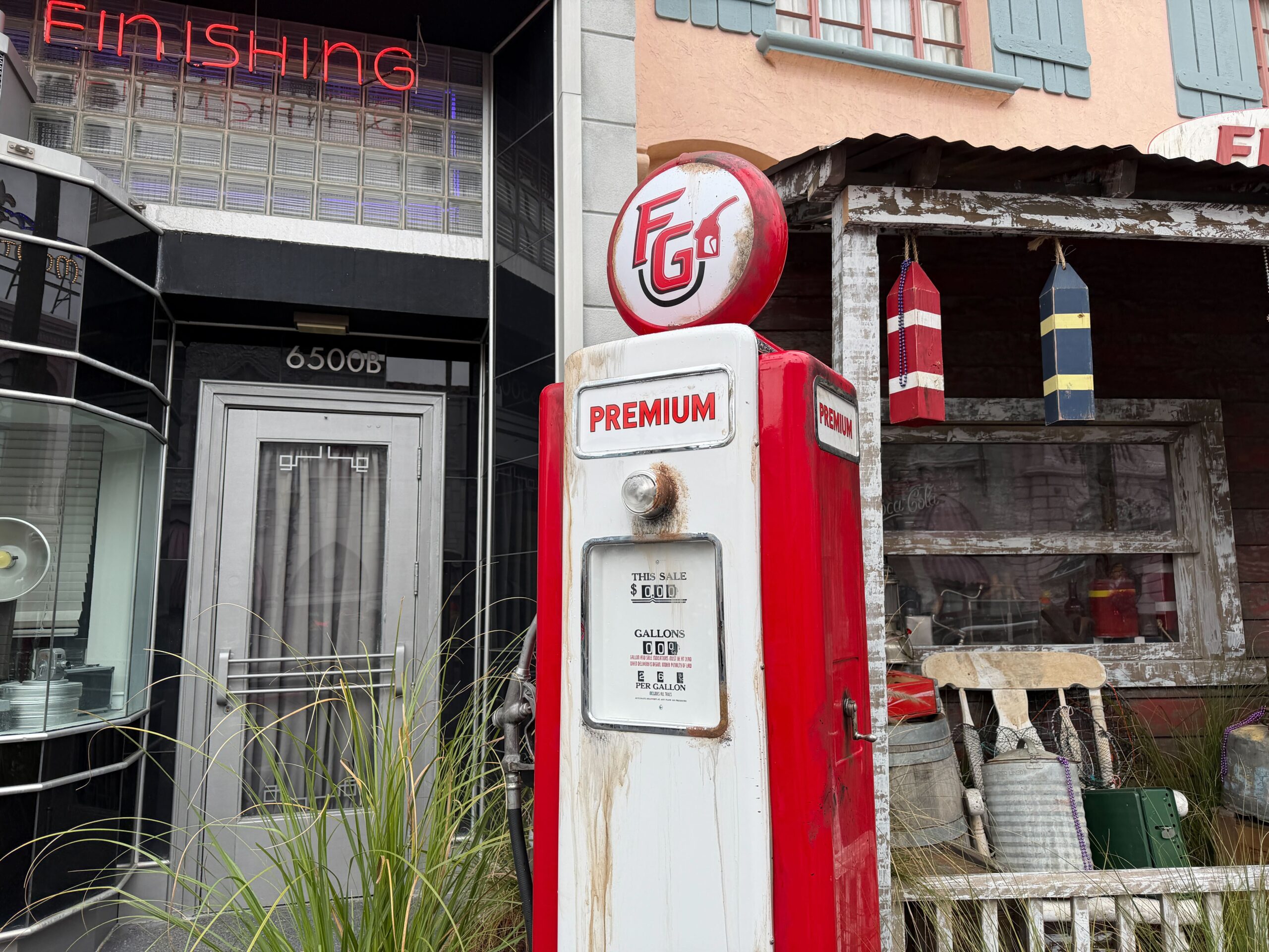 A rusty gas pump is at the corner of the patio.