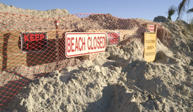 Erosion threatens homes; emergency sand trucked to beach
