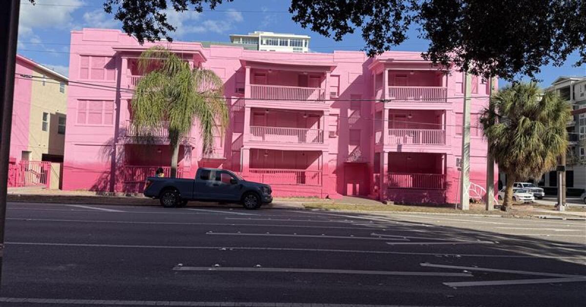 Buildings painted pink ahead of demolition to make way for 29-story tower