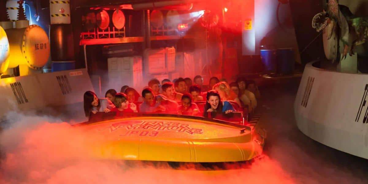 Guests ride Jurassic Park River Adventure