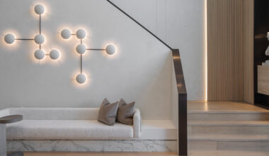 wood and porcelain interplay across curved interiors in florida renovation