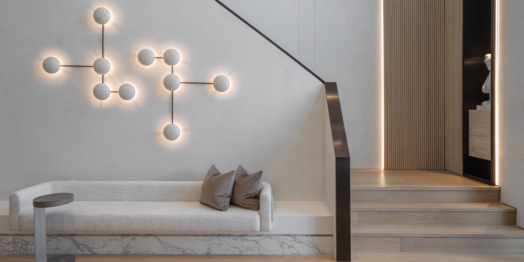 wood and porcelain interplay across curved interiors in florida renovation