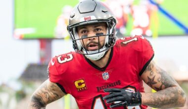 Dec 24, 2023; Tampa, Florida, USA;Tampa Bay Buccaneers wide receiver Mike Evans (13) catches the touchdown against the Jacksonville Jaguars in the second quarter  at Raymond James Stadium. Mandatory Credit: Jeremy Reper-Imagn Images