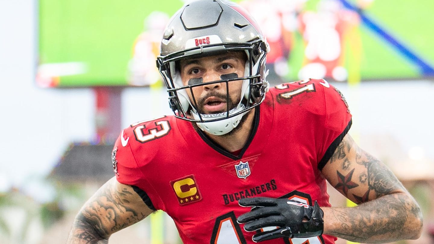 Dec 24, 2023; Tampa, Florida, USA;Tampa Bay Buccaneers wide receiver Mike Evans (13) catches the touchdown against the Jacksonville Jaguars in the second quarter  at Raymond James Stadium. Mandatory Credit: Jeremy Reper-Imagn Images