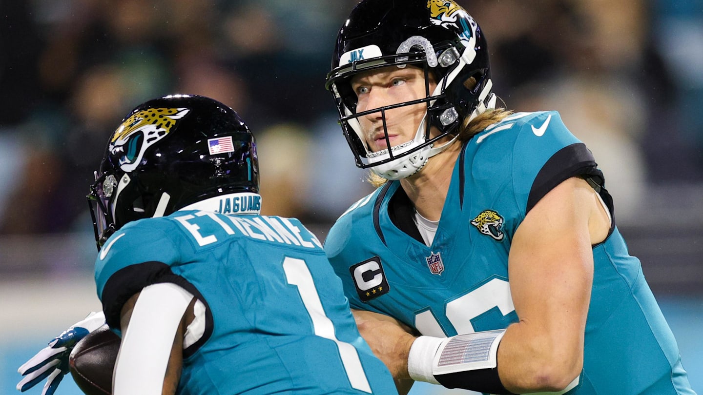 Dec 17, 2023; Jacksonville, Florida, USA;  Jacksonville Jaguars quarterback Trevor Lawrence (16) hands off to running back Travis Etienne Jr. (1) against the Baltimore Ravens in the first quarter at EverBank Stadium. Mandatory Credit: Nathan Ray Seebeck-Imagn Images