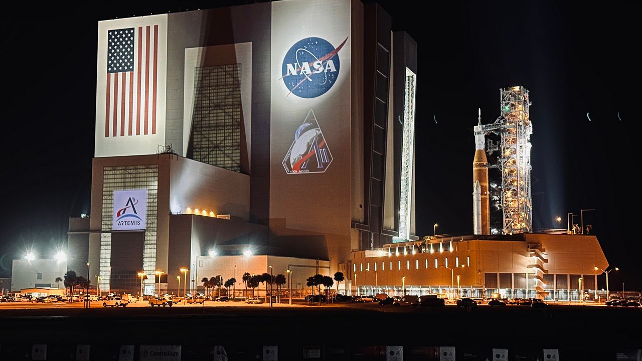 NASA rolled out the 322-foot (98.27-meter) tall Space Launch System rocket and the Orion capsule during the early morning on Friday, March 20, 2026. (Spectrum News/Jon Shaban)