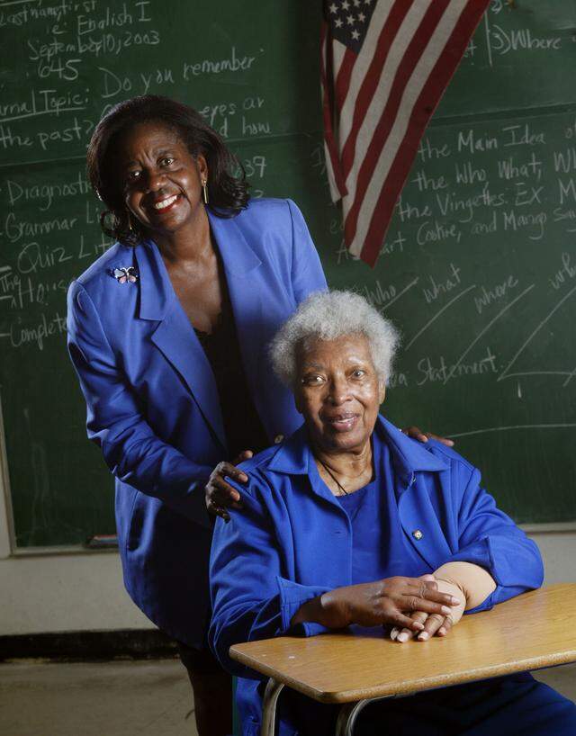 Dorothy Jenkins Fields, left, who founded Miami’s Black Archives, poses with her most influential teacher, Marian Shannon, while visiting Booker T. Washington High School in Miami in 2003.