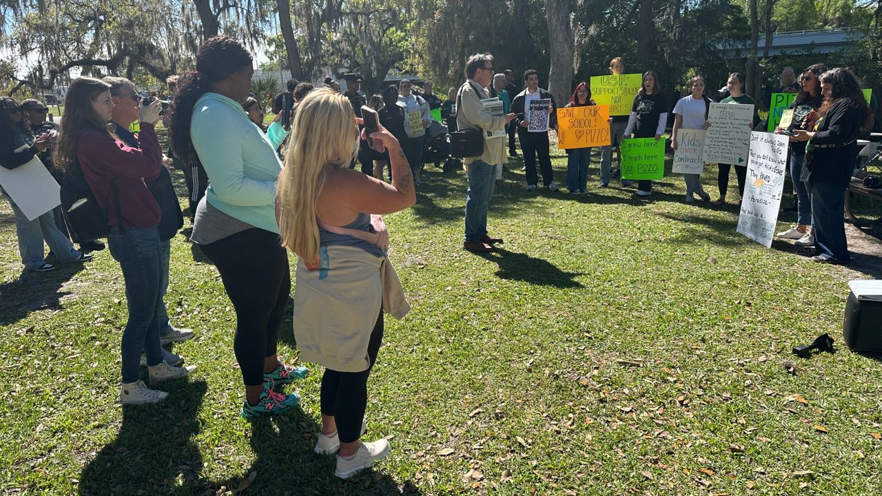 A large group of teachers, staff, parents, and students spent one of their days during spring break rallying to keep Pizzo K-8 open. (Spectrum News/Fallon Silcox)