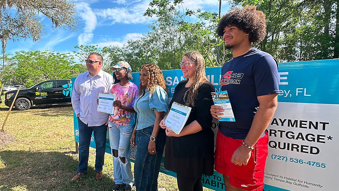 Family surprised with new home during Habitat groundbreaking