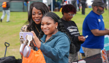 Florida A&M University President Marva Johnson, J.D., shares a moment with a student during the Harambee Festival, capturing the spirit of connection and community on campus.