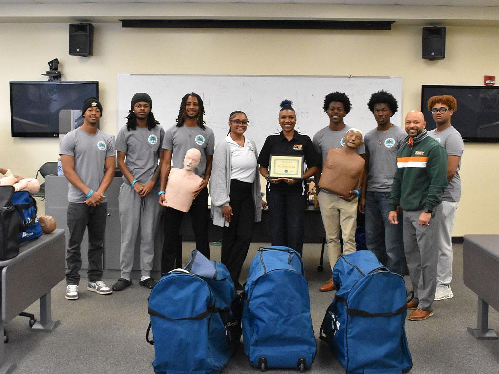 Students from Florida A&M University’s School of Allied Health Sciences and members of the Black Men in Medicine student organization pose after completing a CPR certification workshop on the FAMU campus.