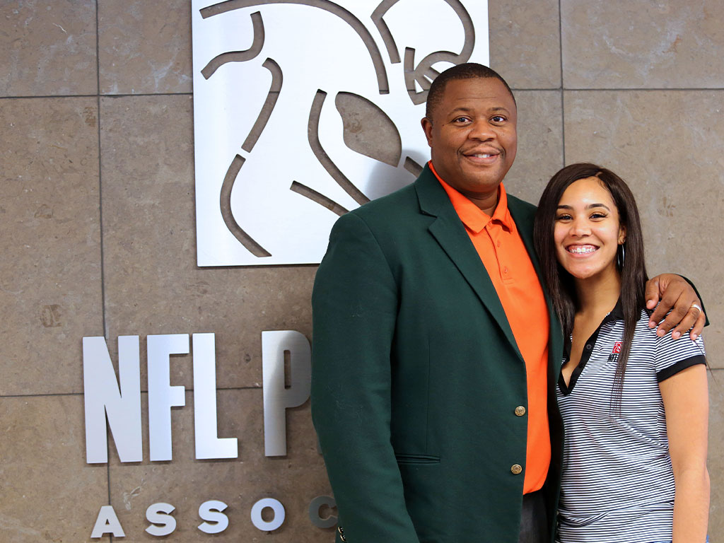 Florida A&M University alumna Nyeja Skye Warner poses with Vaughn Wilson infront of the National Football League Players Association.
