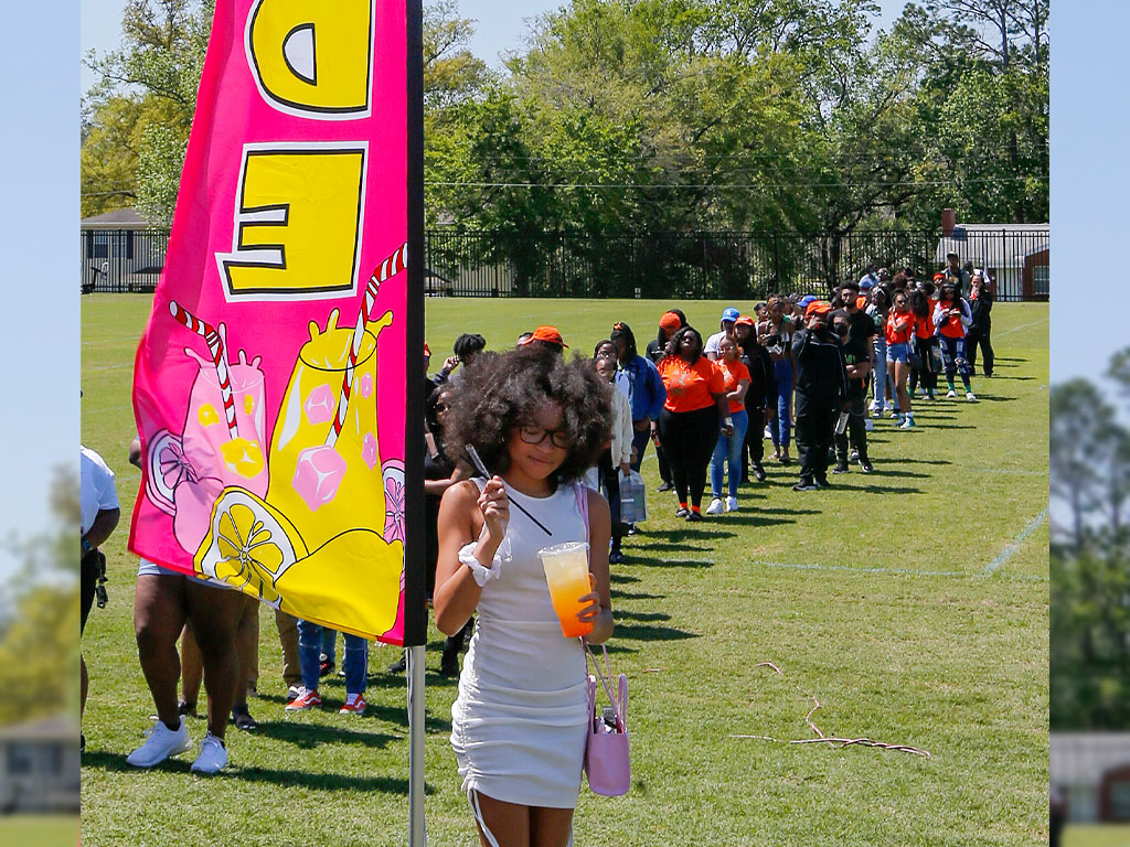 Student enjoying a fresh lemonade at Be Out Day