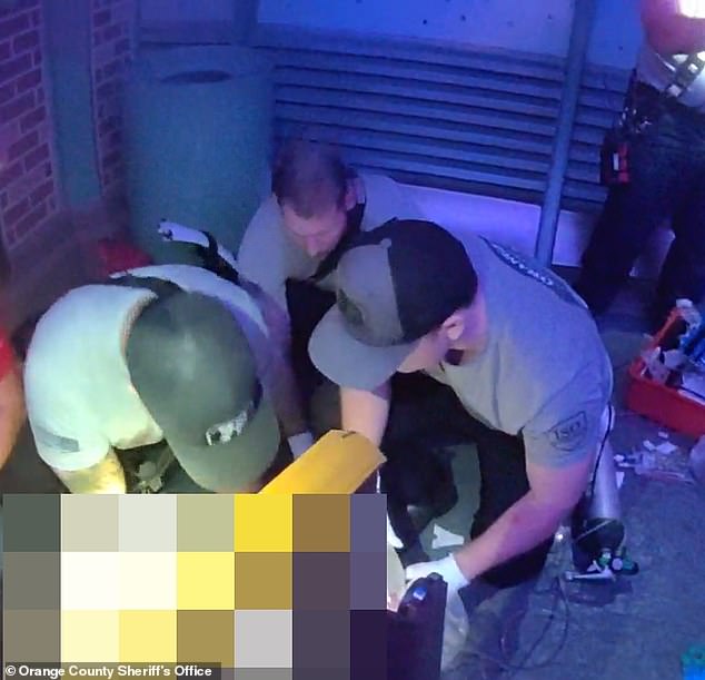 Emergency teams are seen here performing chest compressions on Zavala beside the rollercoaster