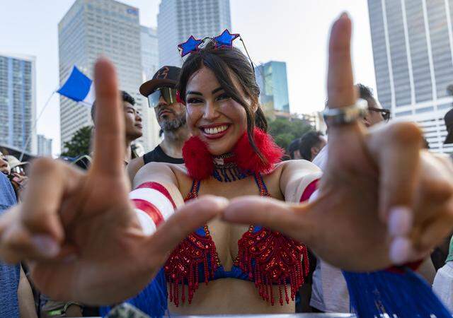 Nahyua Muniz makes a ‘U’ with her hands as Alan Walker performs during Ultra Music Festival’s 26th anniversary at Bayfront Park on Saturday, March 28, 2026, in downtown Miami, Fla.