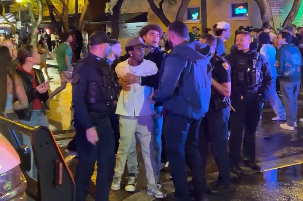 One of the brawlers getting held back after police arrived. Romaine Maurice for NY Post