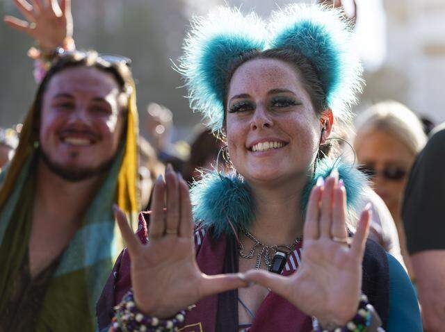 Kaitlin Marrache makes a ‘U’ with her hands as Alan Walker performs during Ultra Music Festival’s 26th anniversary at Bayfront Park on Saturday, March 28, 2026, in downtown Miami, Fla.