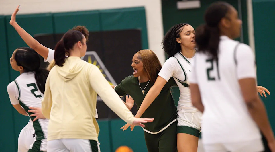 Jacksonville University head coach Special Jennings, center, tries to get her players under control after a fight in the fourth period with University of North Florida players during a women's basketball Friday February 27, 2026 at Jacksonville University in Jacksonville, Fla. [Doug Engle/Florida Times-Union]