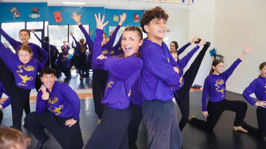 Jonny Serrat and his Melody Lane Performing Arts Center teammates strike a pose at the 2026 Junior Theatre Festival in Atlanta.