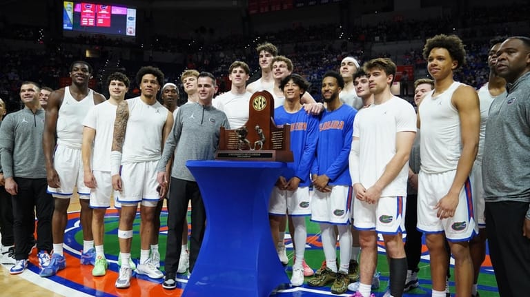 Florida celebrates their SEC regular season trophy prior to taking...