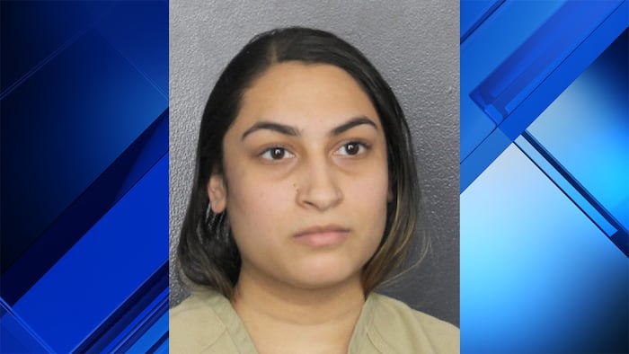 Substitute teacher arrested for bringing gun to school after grabbing wrong purse