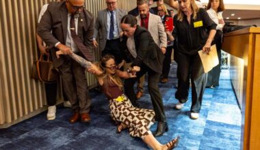 Charges dropped after woman dragged from Miami-Dade chambers