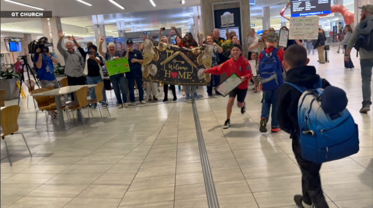 The final members of the group came home on Tuesday to cheers