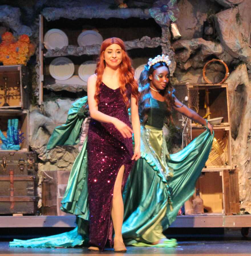 Ta da. This onstage costume change took mere seconds to accomplish due to layering.