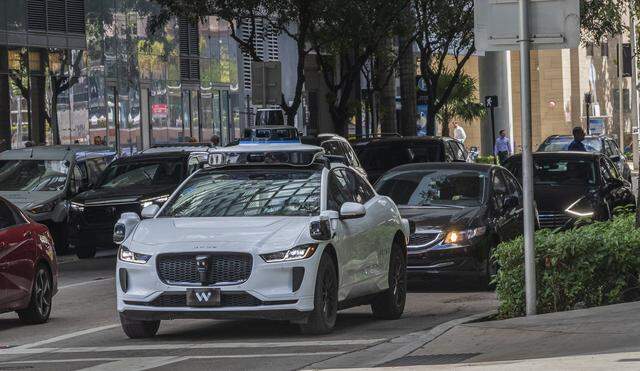 View of a Waymo self driving car at SW 7th Street and South Miami Avenue, with Miami Herald reporters Catherine Odom and Michael Butler, onboard, as they head to the Brickell Centre, to test the Waymo-Self-Driving Cars - Autonomous Vehicles - Ride-,on Wednesday, February 25, 2026.