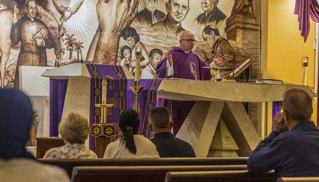 Father Eliosbel Pereira Almaguer, parochial vicar at La Ermita de Caridad, Our Lady of Charity National Shrine, in Miami leads a Mass hours after Cuban leader Miguel Díaz-Canel had confirmed that Cuban leaders are talking with the Trump administration, Friday, March 13, 2026.