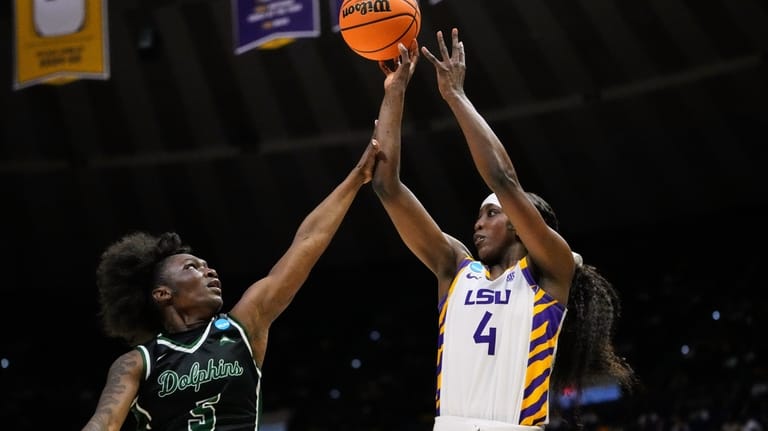 LSU guard Flau'jae Johnson (4) shoots against Jacksonville guard Comari...